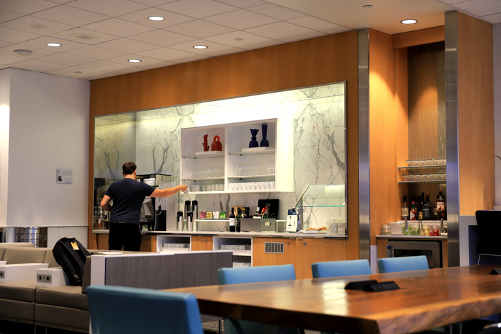 Los Angeles, California, USA - August.01.2019: Inside Delta Sky Club lounge at LAX Airport Terminal 2.
A passenger is trying to get some coffee.